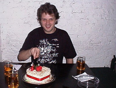 John cutting the birthday cake.