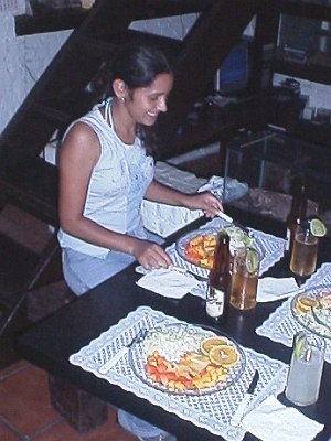 Esme, laughing at the dinner table