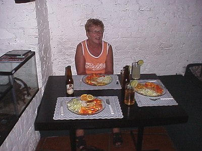 Mom at the dinner table in our apartment.