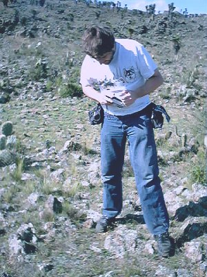 John, examining the ground