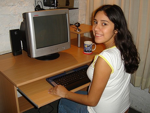 Esme, happy behind her new computer desk.