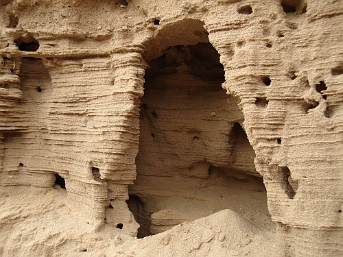 A cave in a sand wall.