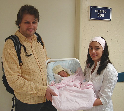 John and Esme holding Alice.