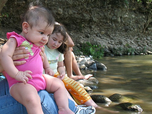 Alice looking at the river.