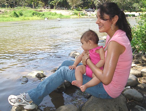 Esme and Alice having fun near the river.