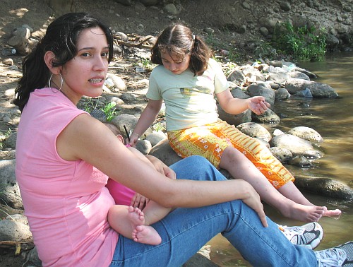 Esme breastfeeding Alice, Katia playing.