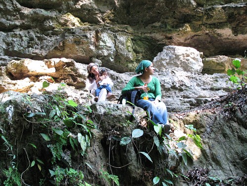 Esme, Alice, and Rocio having a break near the cave entrance.