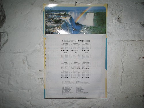 The recycled calendar on the wall.