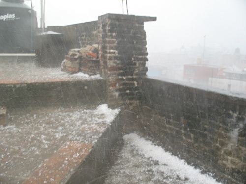 Hail falling on the roof of our apartment.