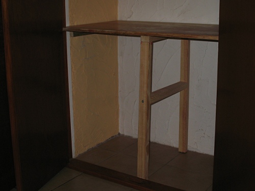 Shelve supported with wooden frame in my closet.