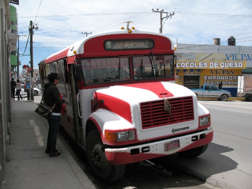 Jilmar about to enter the red bus to Conejo.